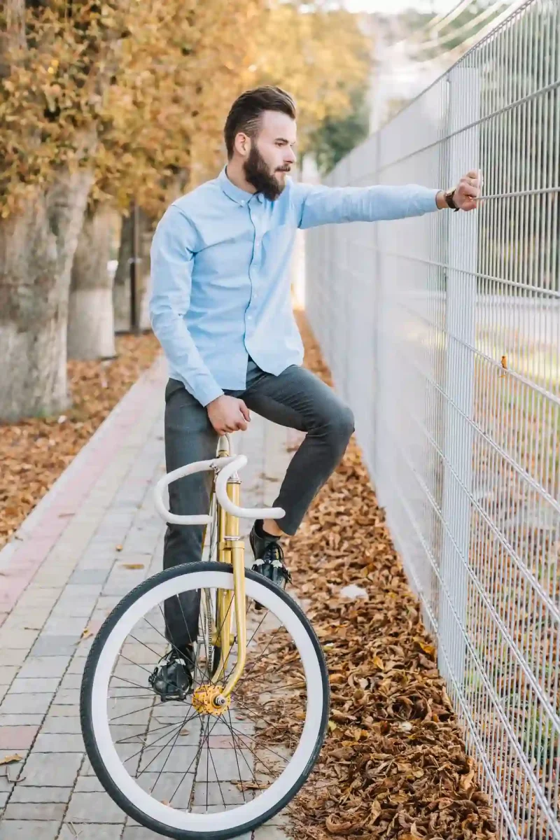 man-bicycle-near-fence-ezgif.com-optiwebp
